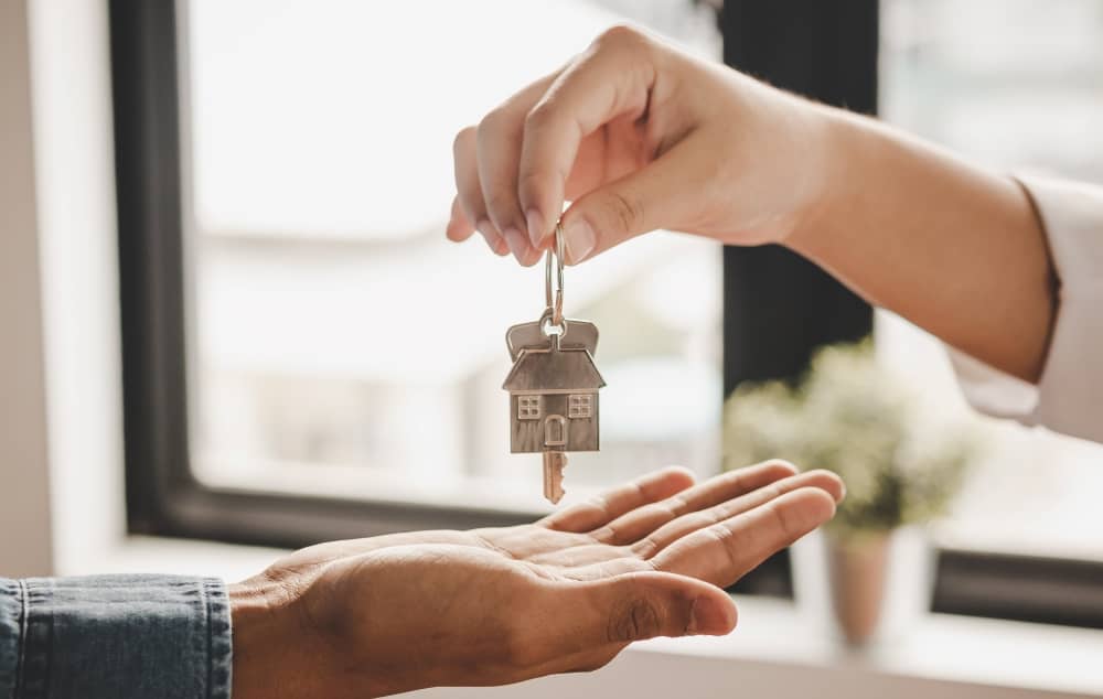 Landlord handing keys to tenant