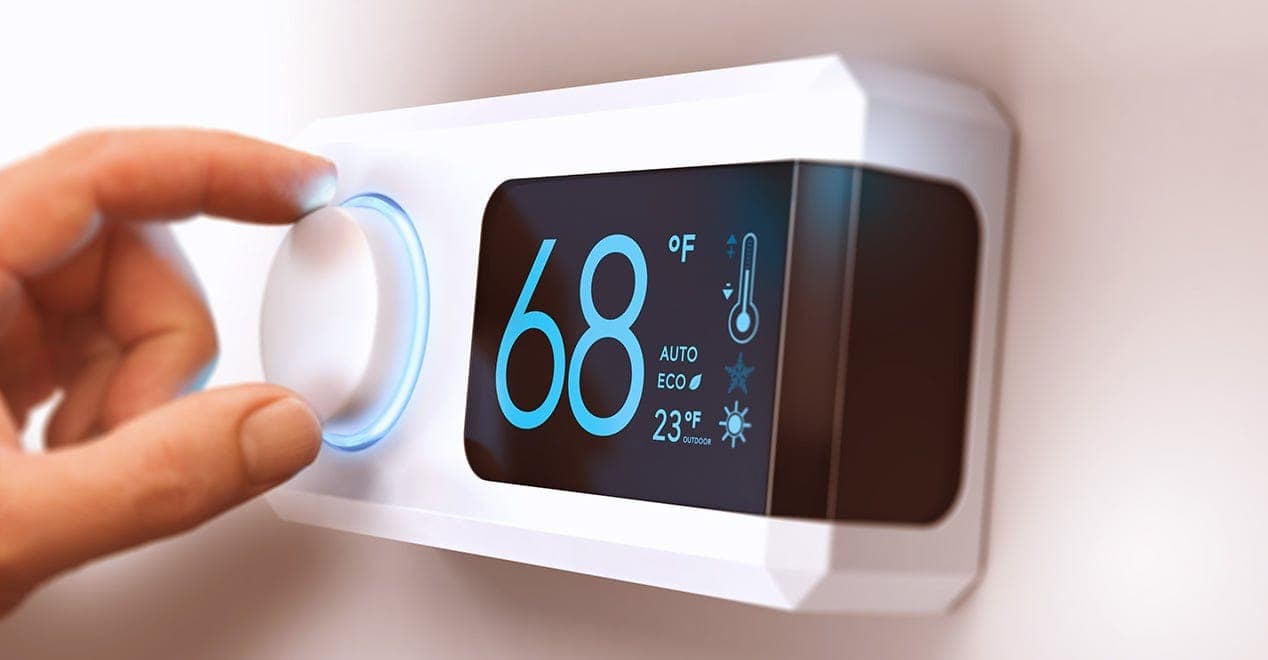 Smart thermostat displaying energy use