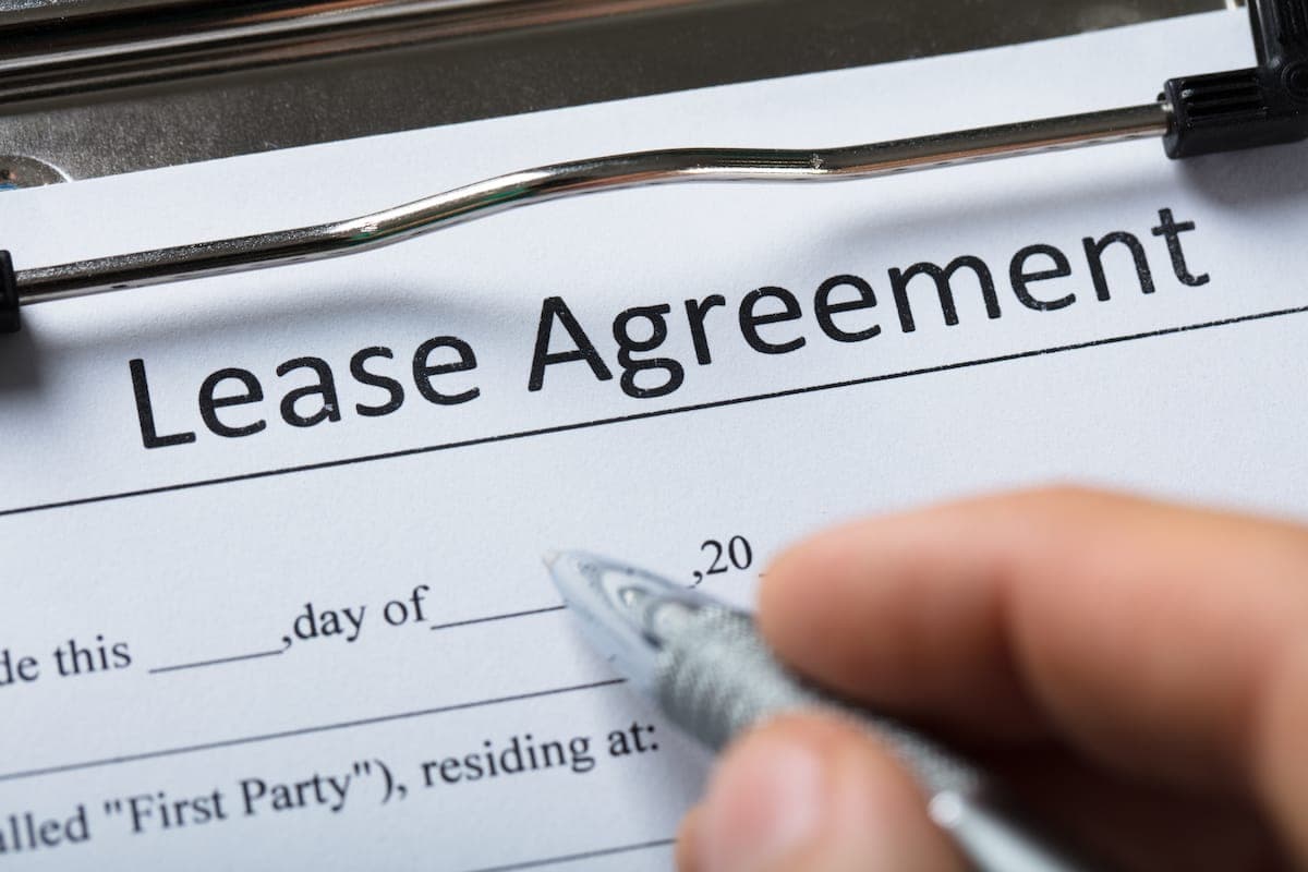 Tenant reviewing a lease agreement before signing